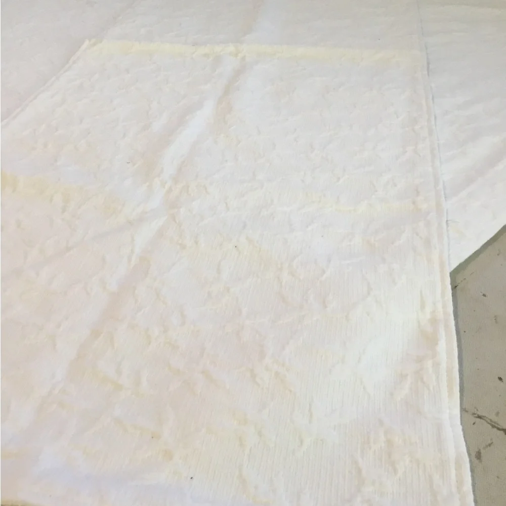 Headboard Slipcover in white matelasse fabric. Slip on. Scalding too
